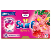 Surf - Tropical Lily 3 In 1 Laundry Detergent Capsules (15 washes, 295.5g) feature pink flowers, butterflies, natural essential oils, and "12h fragrance," keeping your laundry fresh and beautifully scented.